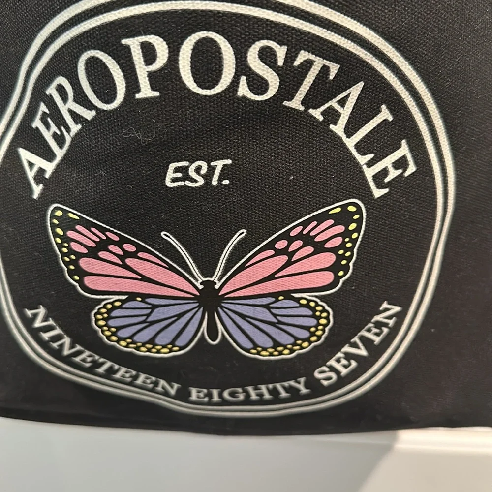 NWT Aeropostale 1987 Black Canvas Crossbody bag with adjustable Strap.